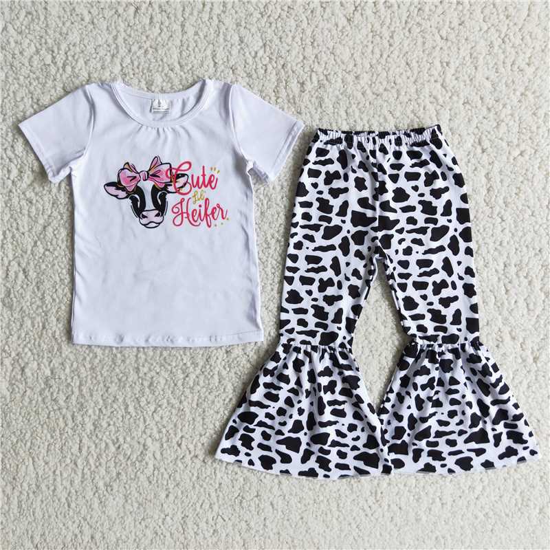 B4-21 Cow print short-sleeved top with bow and cow-spot flared trousers