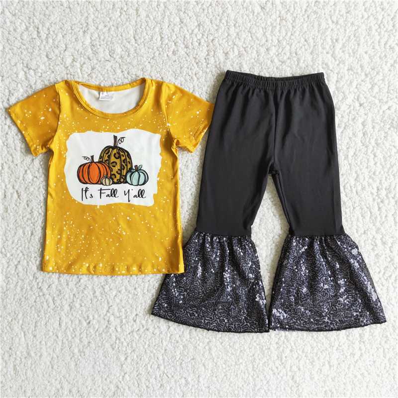 A2-12 Pumpkin-print yellow short-sleeved top with black panelled black sequin flared pants