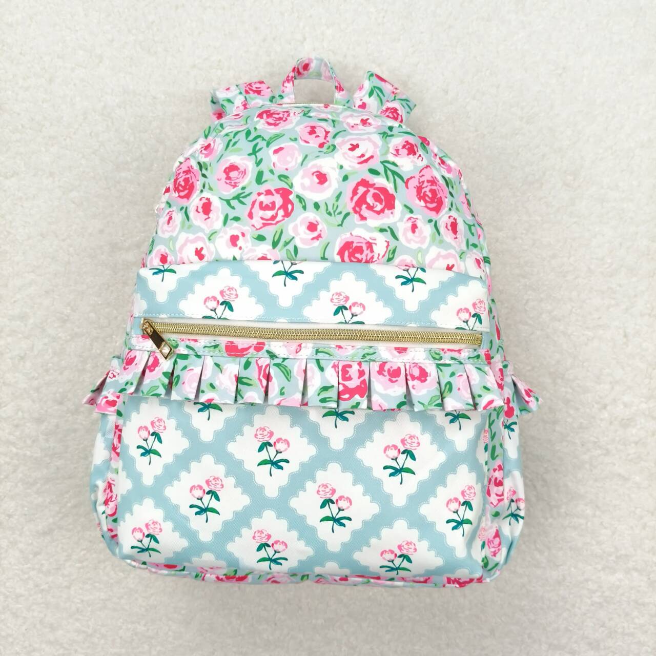 BA0100 Pink flowers light blue backpack