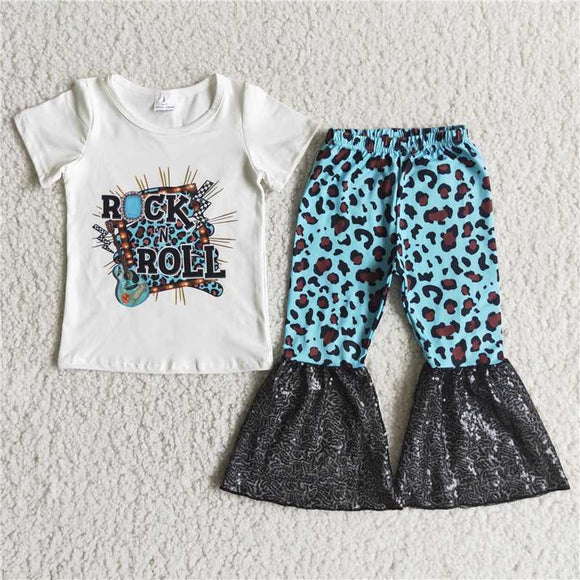 D4-15  White monogram short-sleeved top with blue leopard print and black sequin flared pants